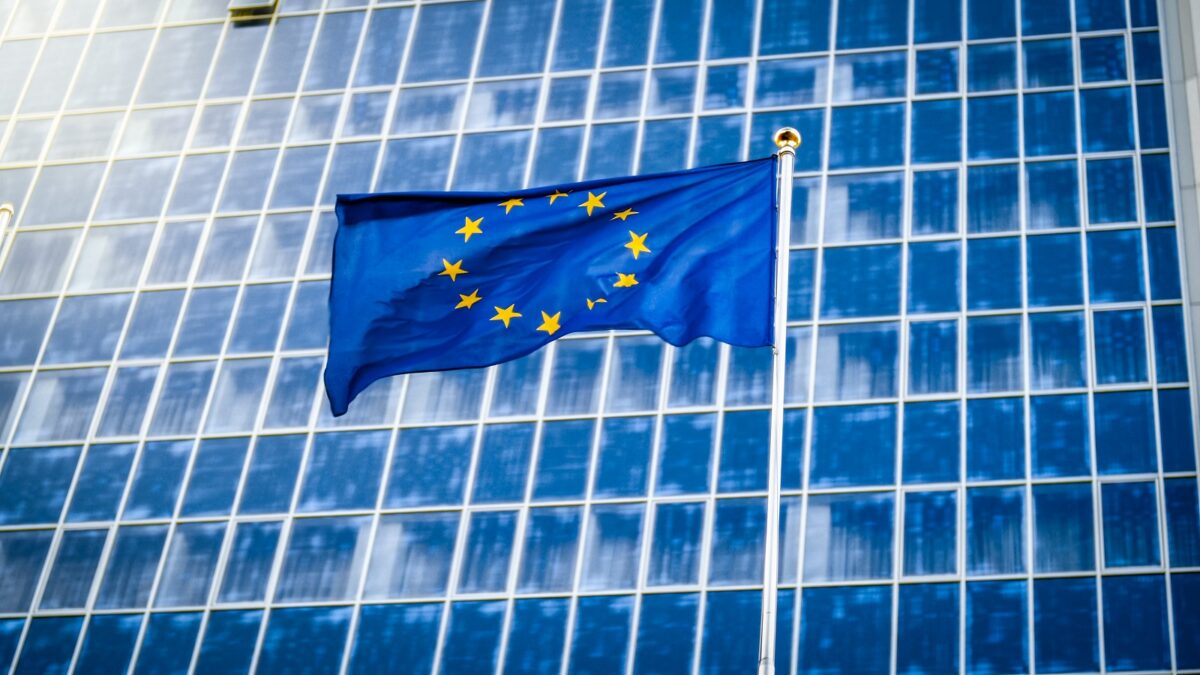 1600image european union flag with staras blue background against big modern office building concept ecenomy development government politics